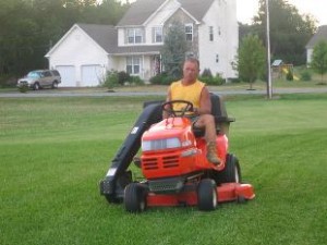 mowing-lawns man mowing lawn