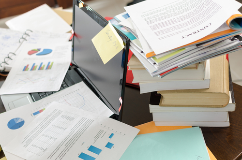 View of a untidy and cluttered desk